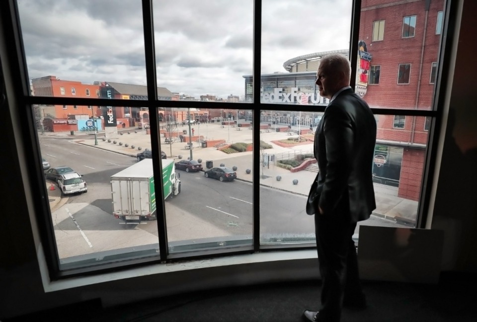 <strong>CEO of Memphis-based FedEx Logistics, Richard Smith steps away from the media to look out the window of what will be his new office overlooking the FedExForum on Feb. 12, 2019.</strong> (Daily Memphian file)