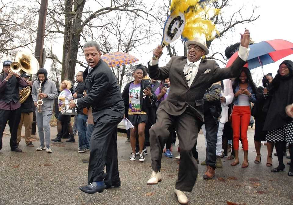 <strong>A second line parade honors local chef Gary Williams on Saturday, Dec. 15, 2018. The band Williams helped create organized the parade that culminated at Krewe of DeJavu, Williams&rsquo; restaurant at 936 Florida.</strong> (Stan Carroll/Special to The Daily Memphian)