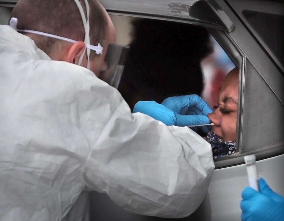 <strong>National Guard medics test for COVID-19 at the Christ Community testing site in Frayser on April 25, 2020. A vaccine for children could lag behind a vaccine for adults by months.</strong> (Jim Weber/Daily Memphian file)