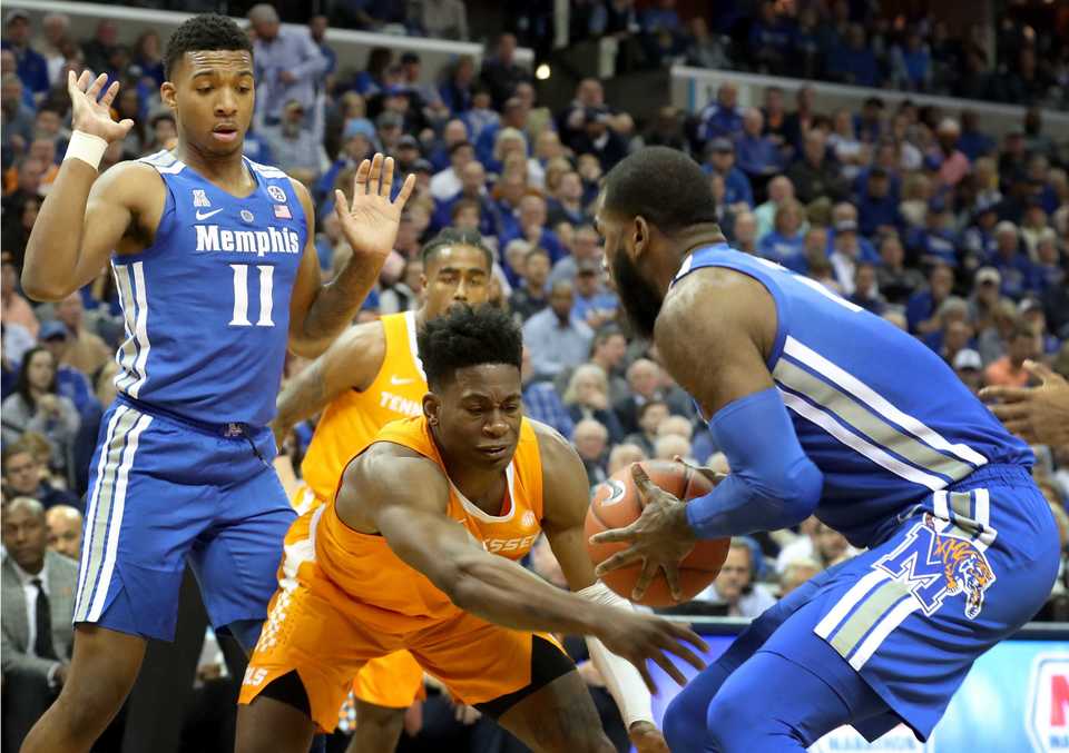 <p class="p1"><span class="s1"><b>University of Memphis forward Raynere Thornton (4) and University of Tennessee guard Admiral Schofield (5) go for a loose ball&nbsp;during the Tigers game against the Volunteers at FedExForum in Memphis on Saturday, Dec. 16, 2018. </b>(Karen Pulfer Focht/Special to The Daily Memphian)</span>