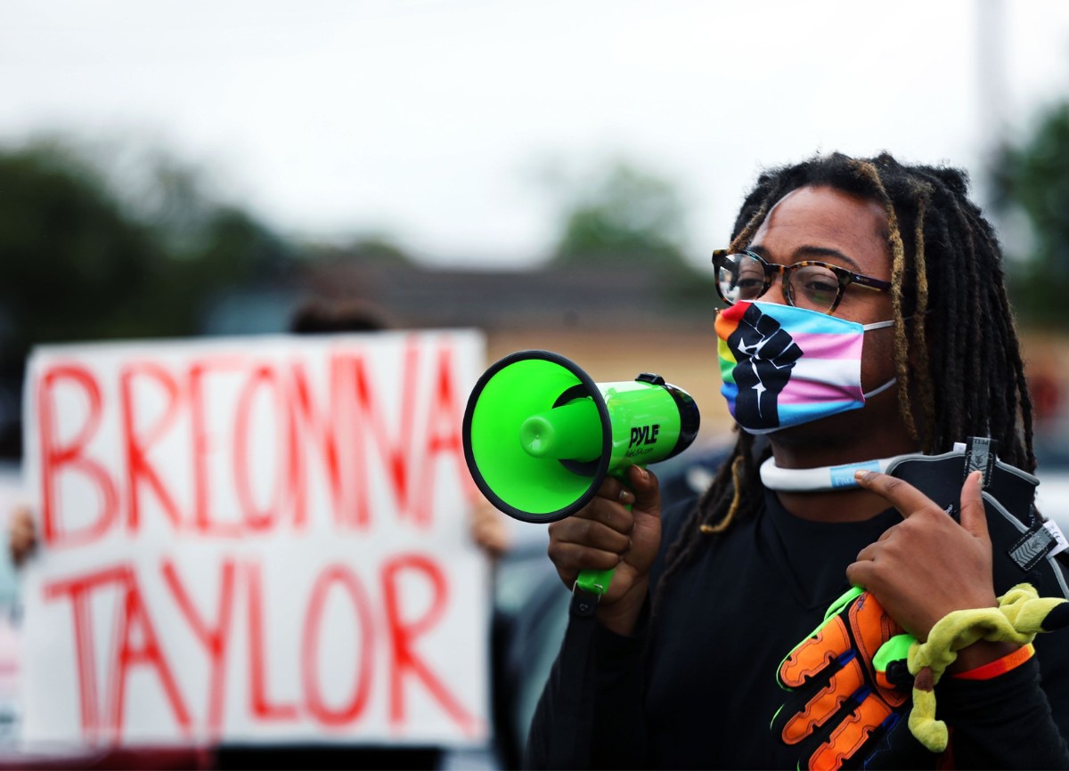 <strong>A protester chants through a megaphone outside the Shelby County Criminal Justice Center on Sept. 24.</strong> (Patrick Lantrip/Daily Memphian)