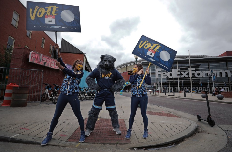 <strong>Grizz Girls Kelsee (left) and Corinne stand in front of the FedExForum with Grizz to to encourage people to register to vote during a voter registration drive Sept. 26, 2020.</strong> (Patrick Lantrip/Daily Memphian)