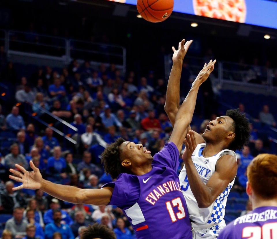 <strong>Will DeAndre Williams get to play this season? The 6-foot-9 forward was wearing an Evansville uniform (13) when he put pressure on Kentucky's Immanuel Quickley during an NCAA college basketball game in Lexington, Ky., Tuesday, Nov. 12, 2019.</strong> (James Crisp/AP file)
