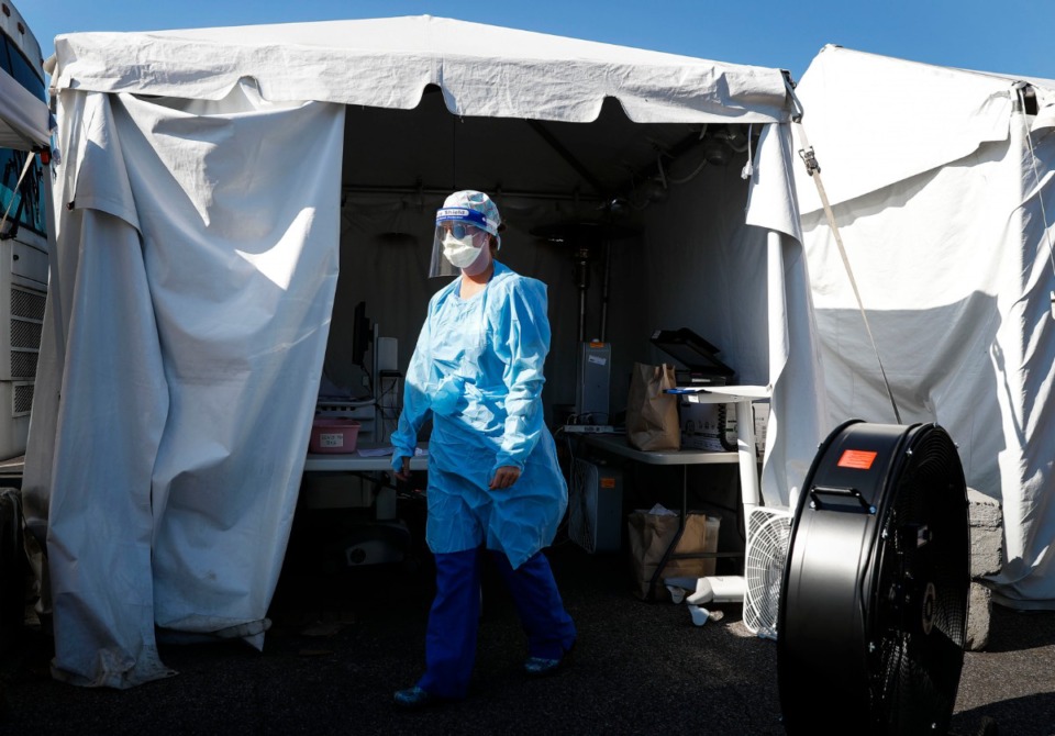 <strong>Registered nurse Holly Cote administers COVID-19 testing swabs at a drive-thru testing site Thursday, June 18, 2020 at Baptist Memorial Hospital-Memphis.</strong> (Mark Weber/Daily Memphian)