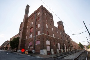 <strong>A plan to redevelop the historic Nylon Net Building site for apartments now calls for the entire building, including smokestack, to be demolished.</strong> (Daily Memphian file)