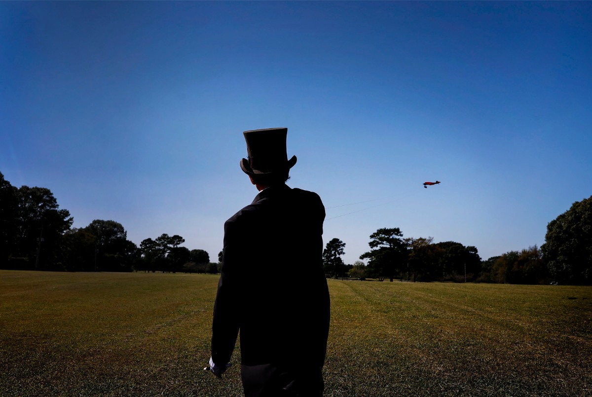 <strong>Lester Goldsmith wearing a circus ringmaster costume maneuvers his Ringmaster airplane while flying on Thursday, Oct. 1, 2020 at Audubon Park.</strong> (Mark Weber/The Daily Memphian)