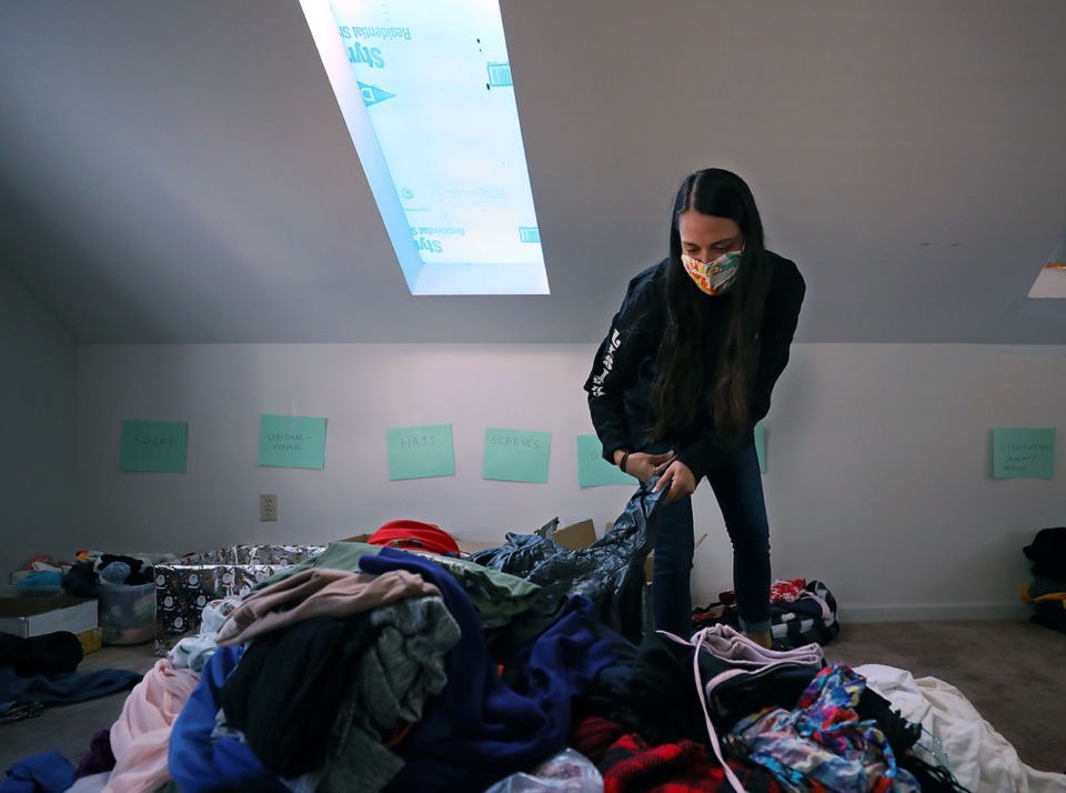 <strong>Whitney Fullerton, administrative assistant of The Lisieux Community, sorts through donated clothes Oct. 7, 2020 to give to the prostitutes the nonprofit provides aid for.</strong> (Patrick Lantrip/Daily Memphian)
