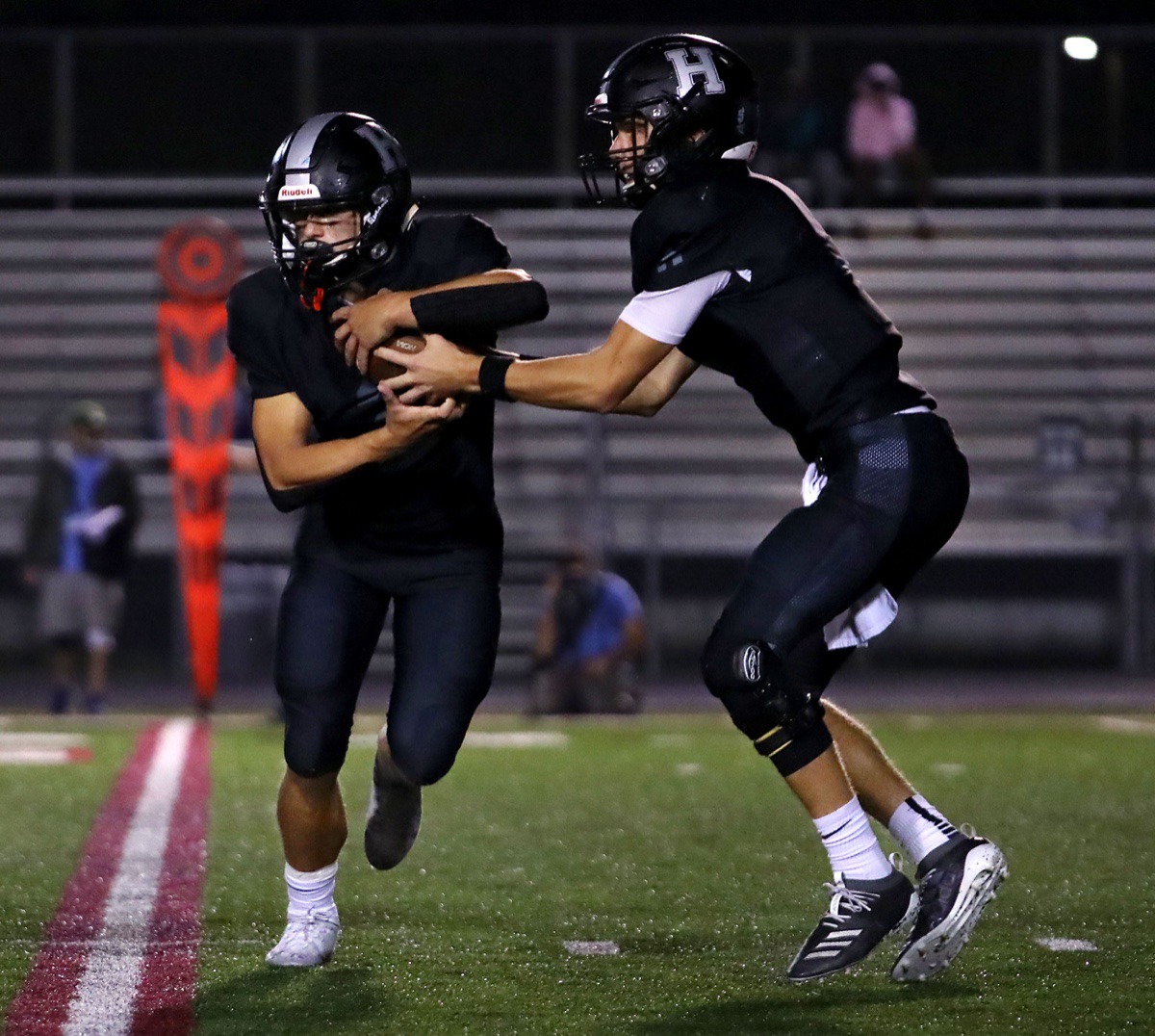 <strong>Houston quarterback Gray Nischwitz (5) pulls the ball back from running back Ben Stegall (2) for a play against Collierville Oct. 9.</strong> (Patrick Lantrip/Daily Memphian)