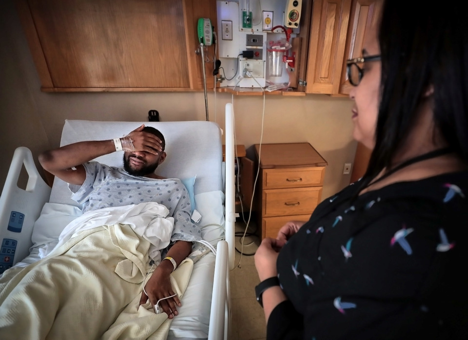 <strong>Diabetes patient Percy Earl talks with social worker Renesa Clemons about his diet, medicine, and how often he checks blood sugar during an interview on Dec. 18, 2018, at Regional One Health. Clemons' visit was part of a data-driven effort to reduce high-frequency patients through proactive intervention at Regional One.</strong> (Jim Weber/Daily Memphian)