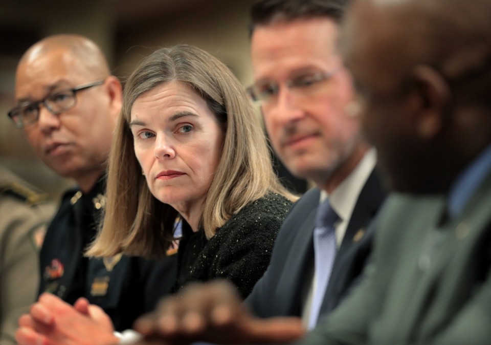 <strong>Shelby County District Attorney Amy Weirich (center) has asked Memphis Police Director Michael Rallings (left) to begin sending all confirmed cases of excessive use of force to her office to determine if criminal charges are merited against the officers. </strong>(Daily Memphian file)