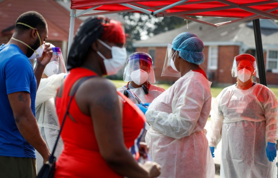 <strong>Christ Community Health Services staff members collect nasal swabs during a walk-up coronavirus testing event on Sept. 17 at Orange Mound Health Center</strong>. (Mark Weber/The Daily Memphian)