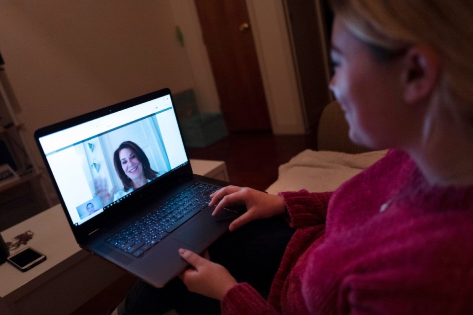 <strong>Some patients who had never used telemedicine before are turning to virtual appointments in hopes of finding relief for headaches.</strong> (Mark Lennihan/AP file)