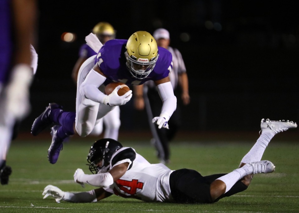 <strong>CBHS tight end Bryce Dalley (11) is brought down by a PURE defender on Oct. 16.</strong> (Patrick Lantrip/Daily Memphian)