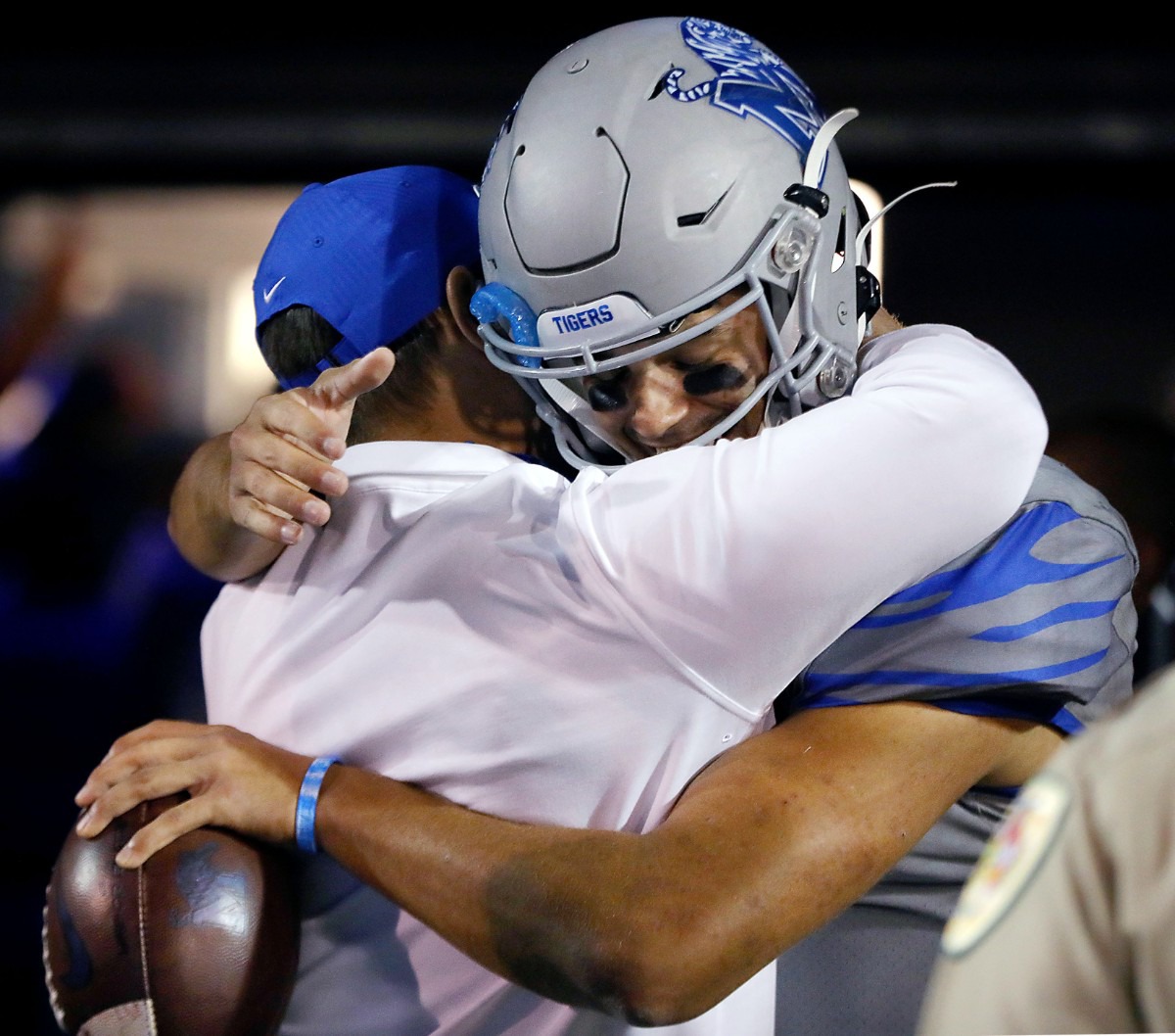 <strong>University of Memphis quarterback Brady White (3) embraces head coach Ryan Silverfield while holding the game ball after an Oct. 17, 2020 game against University of Central Florida at Liberty Bowl Memorial Stadium.</strong> (Patrick Lantrip/Daily Memphian)