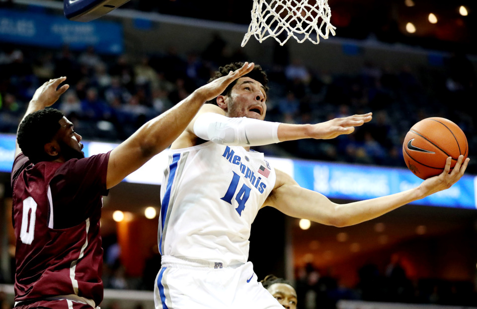 <strong>Memphis Tigers forward Isaiah Maurice (14) attempts a layup against guard Ryan Pippens (0) during&nbsp;the Tigers game against the Little Rock Trojans on Wednesday, Dec. 19, 2018, at FedExForum in Memphis.</strong>(Houston Cofield/Daily Memphian)