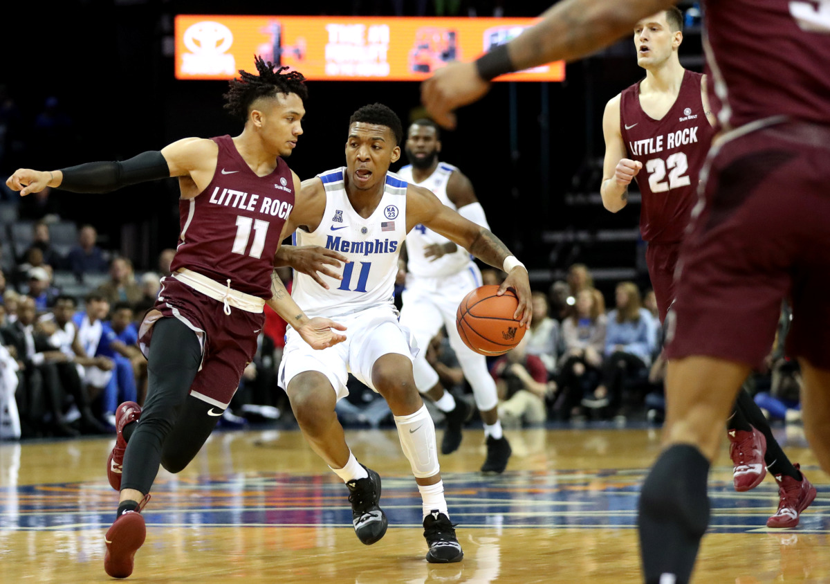 <strong>University of Memphis guard Antwann Jones (11) drives toward the basket against Little Rock Trojans guard Jaizec Lottie (11) during a college basketball game on Wednesday, Dec. 19, 2018, at FedExForum in Memphis.</strong>&nbsp;(Houston Cofield/Daily Memphian)