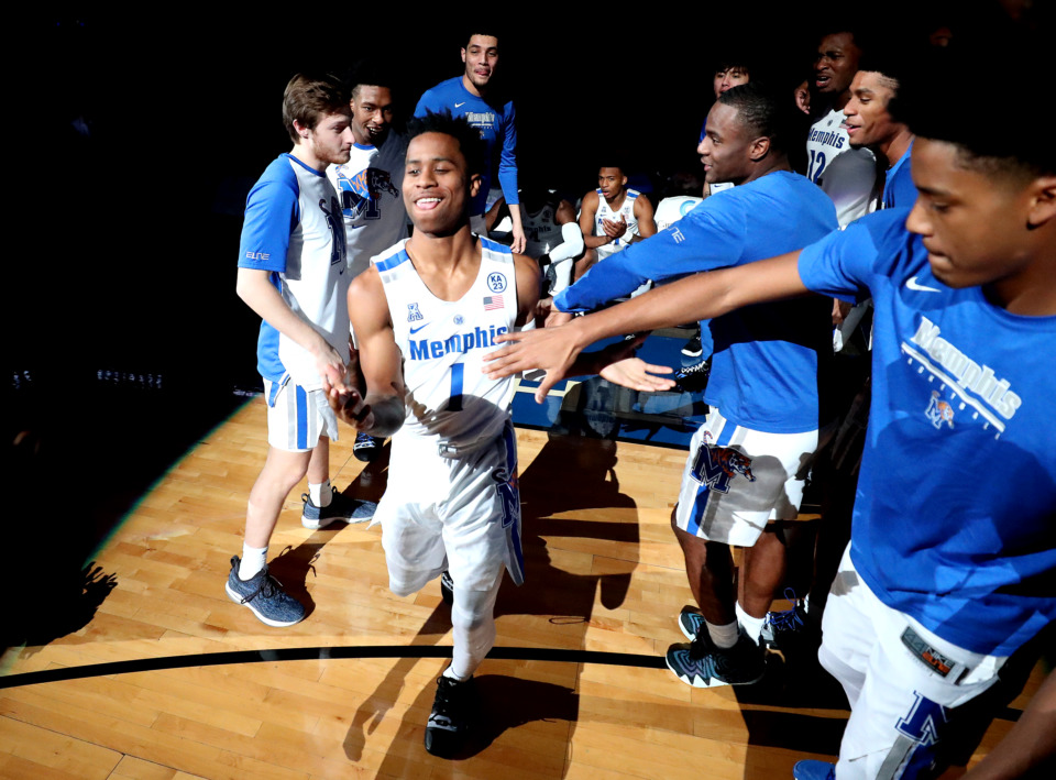 <strong>University of Memphis guard Tyler Harris (1) is cheered by teammates as he runs onto the court before the Tigers game against the Little Rock Trojans on Wednesday, Dec. 19, 2018, at FedExForum in Memphis.</strong> (Houston Cofield/Daily Memphian)