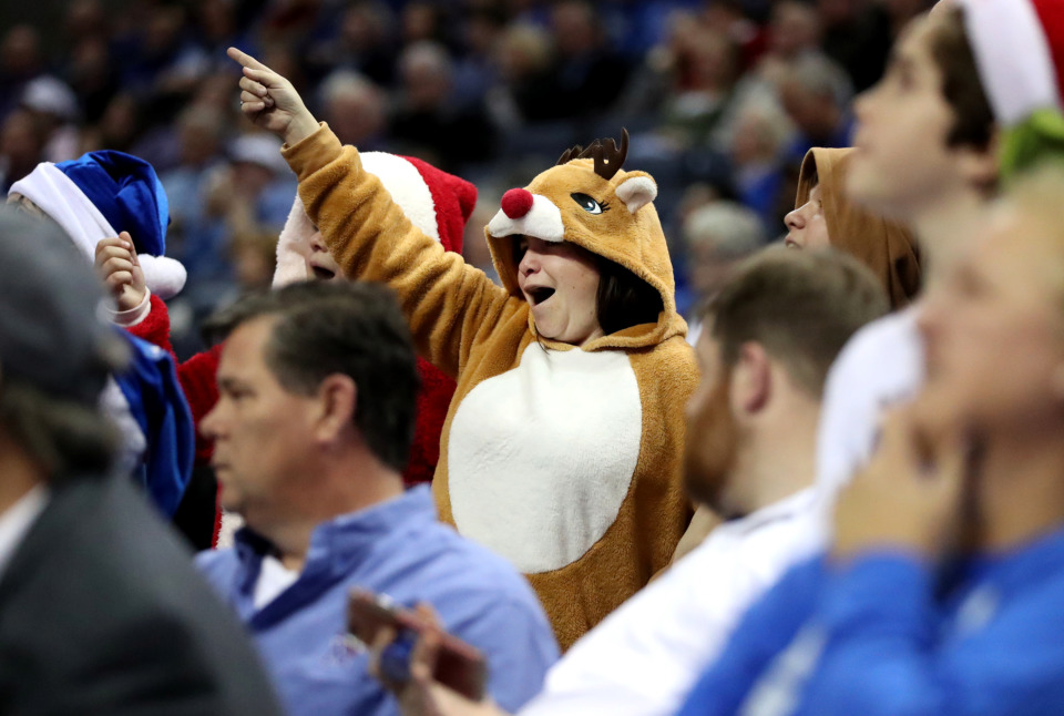 <strong>University of Memphis fans turned out in holiday outfits for the Tigers game against the Little Rock Trojans. The Tigers beat the Trojans 99-89 in a game&nbsp;on Wednesday, Dec. 19, 2018, at FedExForum in Memphis.</strong>&nbsp;(Houston Cofield/Daily Memphian)