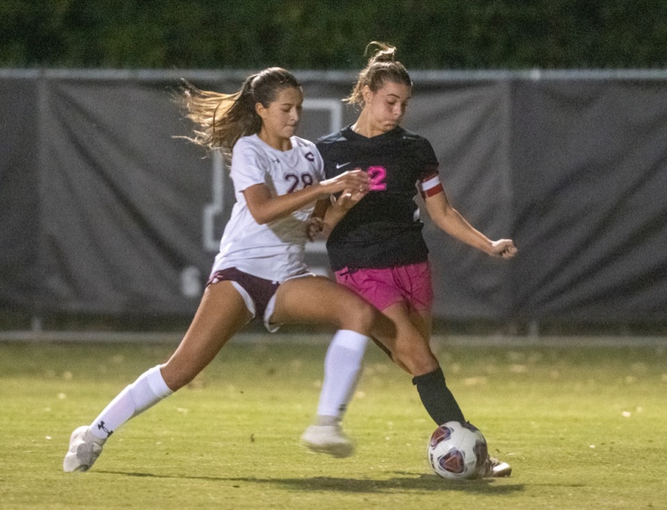 <strong>Collierville High School's Mckayla Desouza defends against Houston's Parker Gelinas during the regional final match Tuesday, Oct. 20, 2020.</strong>(Greg Campbell/Special to The Daily Memphian)
