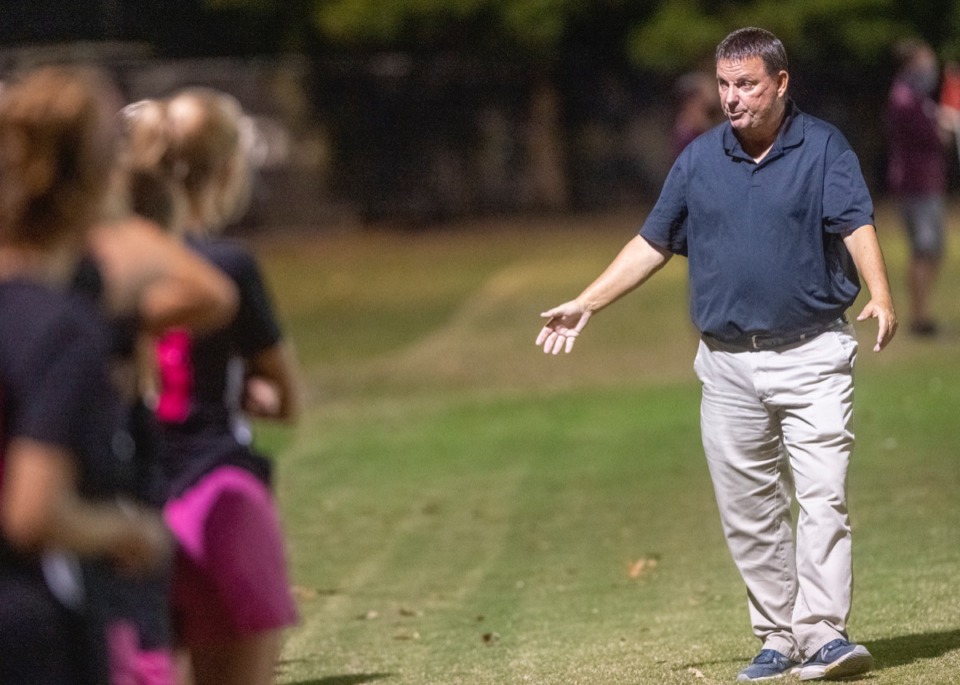 <strong>Houston girls soccer coach David Wolff talks to the girls on the sidelines during the match between his Mustangs and Collierville High School's Dragons on Tuesday, Oct. 20, 2020.</strong> (Greg Campbell/Special to The Daily Memphian)