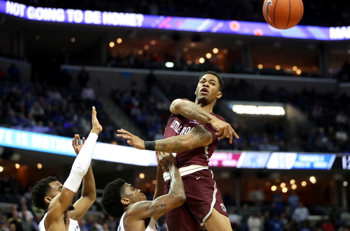 <strong>Memphis Tigers defenders attempt to block a pass by Little Rock Trojans guard Rayjon Tucker (3). The Tigers beat the Trojans 99-89&nbsp;on Wednesday, Dec. 19, 2018, at FedExForum in Memphis.</strong> (Houston Cofield/Daily Memphian)