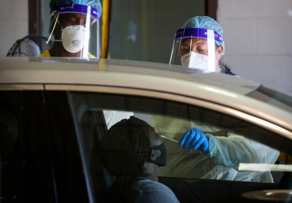 <strong>Christ Community Health Services staff members collect nasal swabs during at a drive-thru coronavirus testing site on Wednesday, Oct. 20, 2020 on Lamar Avenue</strong>. (Mark Weber/The Daily Memphian)