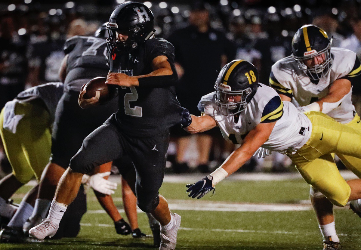 <strong>Houston running back Ben Stegall (left) scrambles past Lausanne defender Ben Bolton (right) for a touchdown on Friday, Oct. 23, 2020.</strong> (Mark Weber/The Daily Memphian)