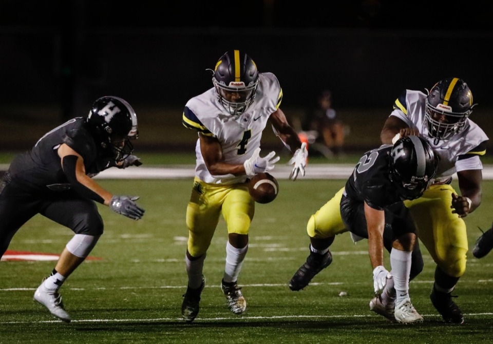 <strong>Lausanne running back A.J. Dillworth (middle) fumbles the ball in the game against Houston on Friday, Oct. 23, 2020.</strong> (Mark Weber/The Daily Memphian)