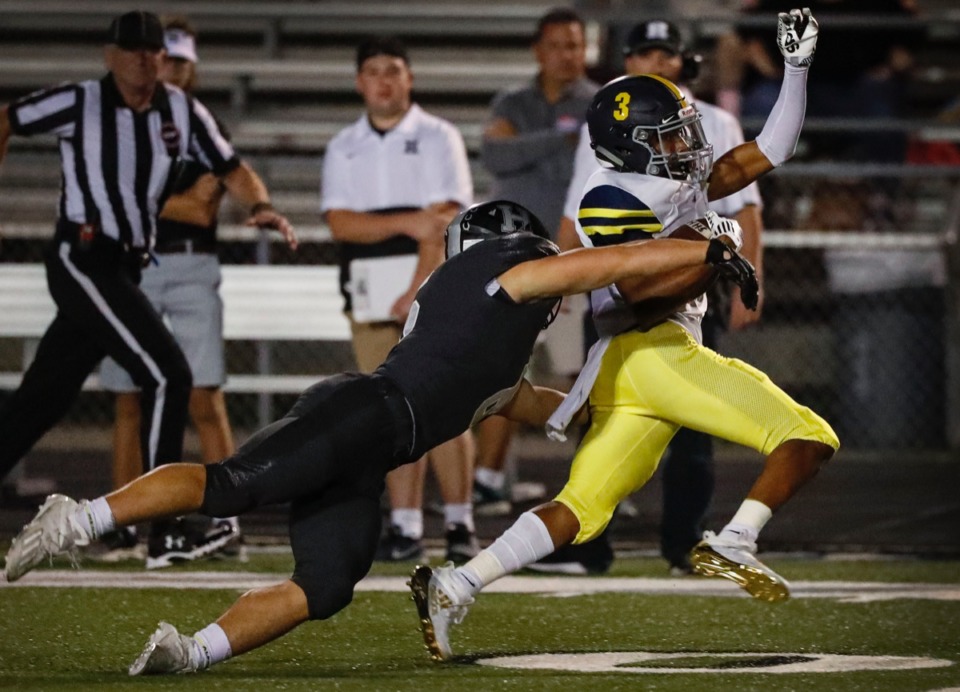 <strong>Lausanne&rsquo;s Travis Dockery (right) is tackled by Houston&rsquo;s Brady Weatherly (left) during action on Friday, Oct. 23, 2020.</strong> (Mark Weber/The Daily Memphian)