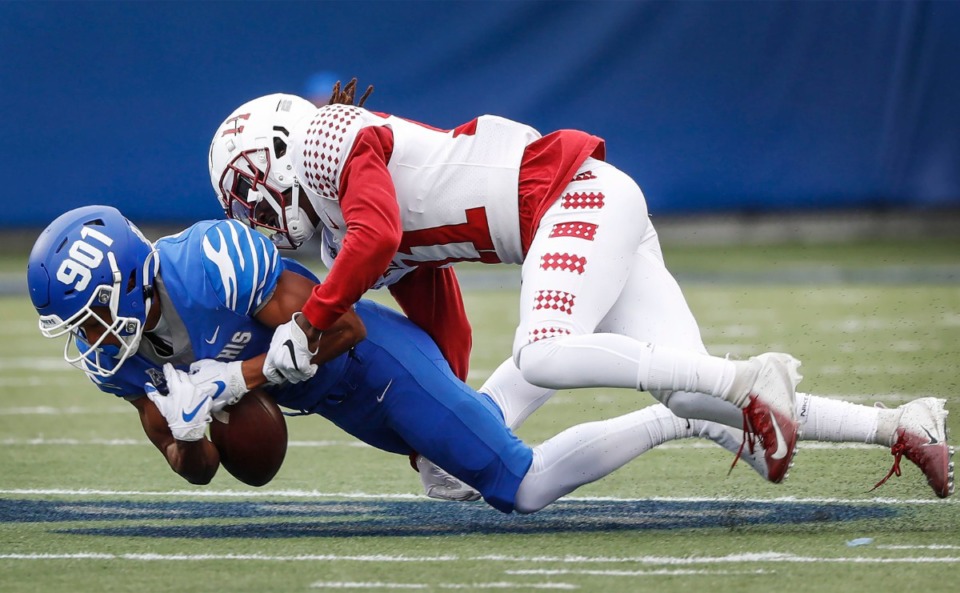 <strong>Memphis receiver Calvin Austin III (left) fumbles the ball after being hit by Temple defender Linwood Crump (right) during action on Saturday, Oct. 24, 2020 at Liberty Bowl Memorial Stadium.</strong> (Mark Weber/The Daily Memphian)