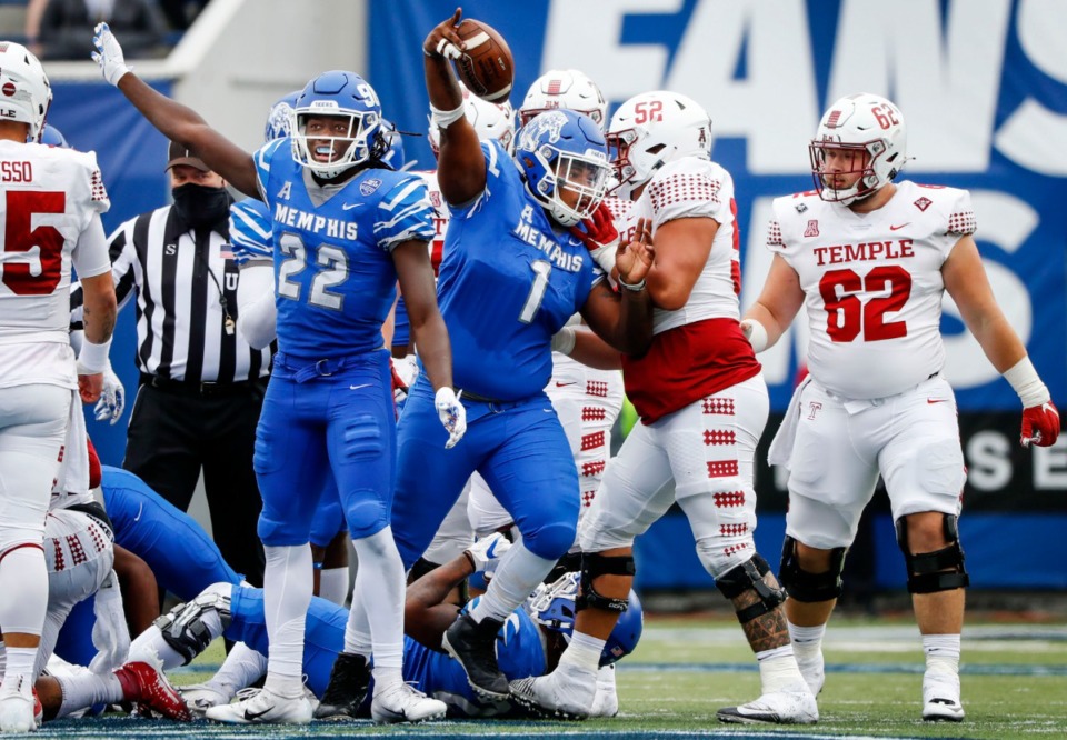 <strong>Memphis defenders Tyrez Lindsey (22) and O'Bryan Goodson (1) celebrate a fumble recovery against the Temple offense during action on Saturday, Oct. 24, 2020 at Liberty Bowl Memorial Stadium.</strong> (Mark Weber/The Daily Memphian)