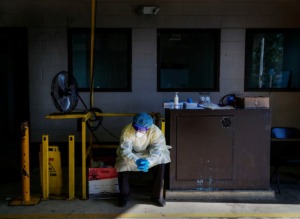 <strong>Christ Community Health Services staff member waits for patients at a drive-thru coronavirus testing site on Wednesday, Oct. 20, 2020 on Lamar Avenue.</strong> (Mark Weber/The Daily Memphian)