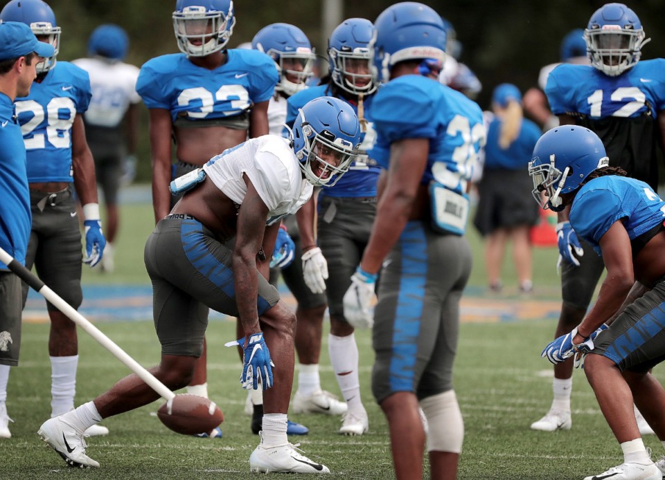 <strong>Defensive back TJ Carter (right) faced off with former Memphis Tiger Damonte Coxie (center) in practice last year.</strong> (Jim Weber/Daily Memphian file)