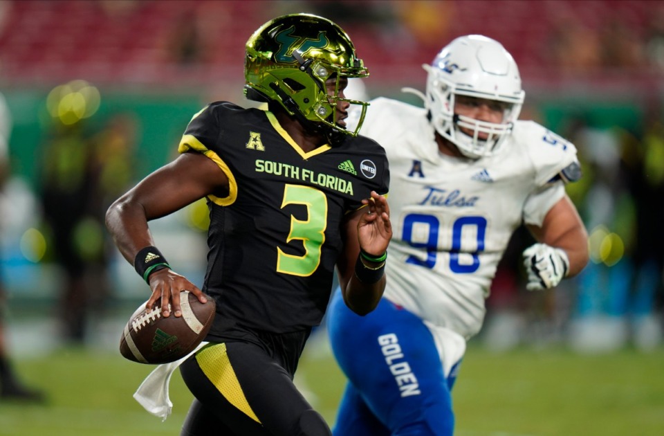 <strong>South Florida quarterback Jordan McCloud (3), shown here outrunning Tulsa defensive lineman Jaxon Player (90) last month, is one of three quarterbacks the Tigers could face on Saturday.</strong> (AP Photo/Chris O'Meara)