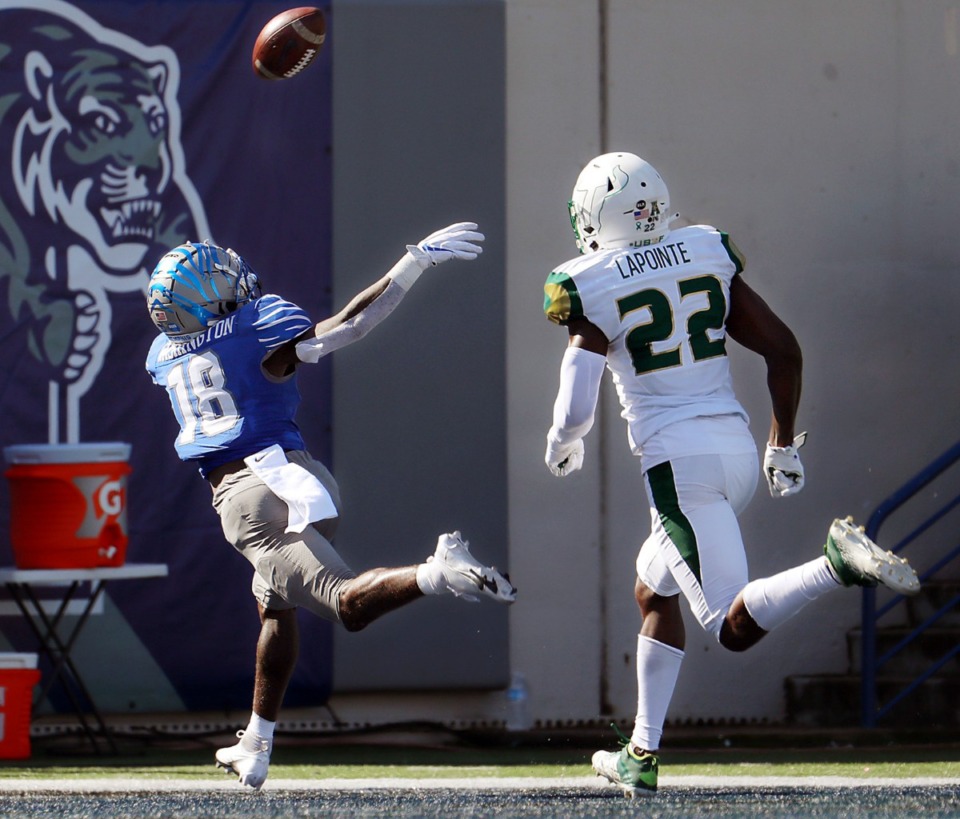 <strong>University of Memphis receiver Tahj Washington (18) stretches out for a would-be touchdown during a Nov. 7, 2020 home game at the Liberty Bowl Memorial Stadium against the University of South Florida.</strong> (Patrick Lantrip/Daily Memphian)