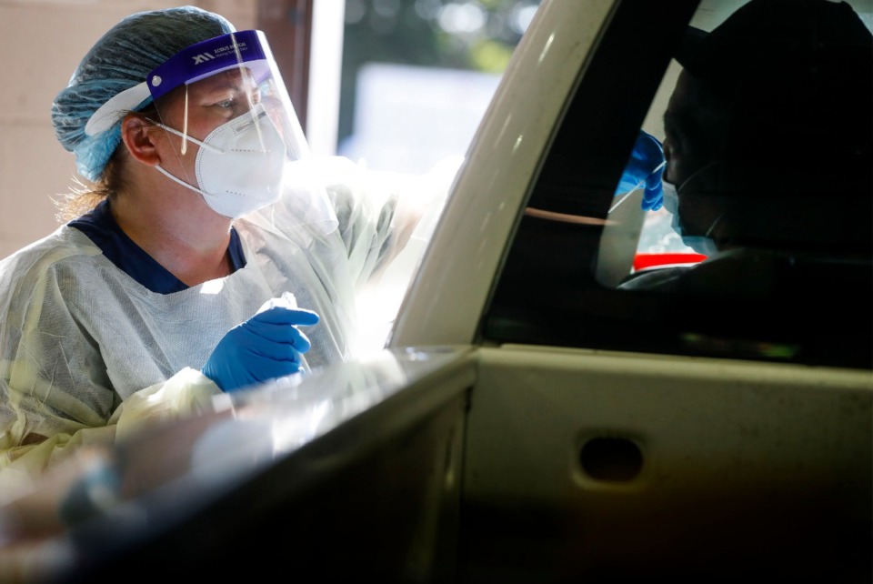 <strong>Christ Community Health Services staff members collect nasal swabs at a drive-thru coronavirus testing site on Wednesday, Oct. 20, 2020 on Lamar Avenue.</strong> (Mark Weber/The Daily Memphian)