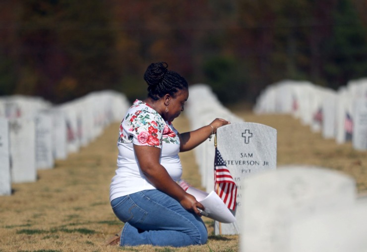 <strong>Laterrilyne Taylor pays her respects to her grandparents on Veterans Day at the West Tennessee State Veterans Cemetery Nov. 11, 2020</strong>. (Patrick Lantrip/Daily Memphian)