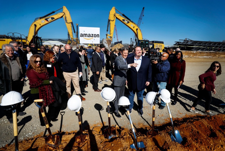 <strong>Tennessee Gov. Bill Lee (middle left) and Amazon Director of Regional Operations Rob Packett (middle right) took pictures after a January 2020 press conference announcing a new Amazon fulfillment center in Raleigh-Frayser.</strong> (Mark Weber/Daily Memphian file)