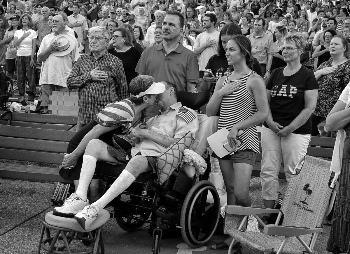 <strong>Bob Bolding attends an Independence Day ceremony with his wife, Ingrid, at one of their favorite places, the Levitt Shell. During the ceremony Bob tugs at Ingrid and asks for a kiss. At this point Bob is wheelchair bound and doesn't get out of the house much.</strong> (Karen Pulfer Focht/Special to The Daily Memphian)
