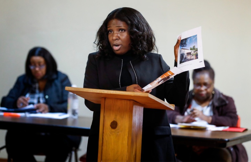 <strong>Councilwoman Michalyn Easter-Thomas holds up renderings of the new Ed Rice Community Center while speaking to residents during a Frayser Community Association meeting Monday, Feb. 17, 2020, at Word of Life Church.</strong> (Mark Weber/Daily Memphian)