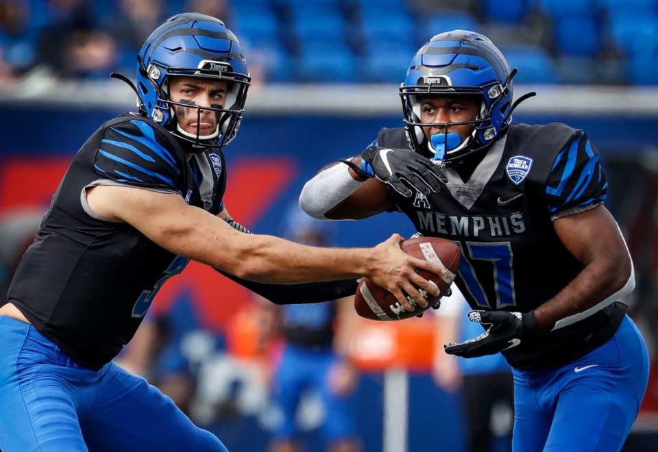 <strong>Memphis quarterback Brady White (left) hands the ball to running back Kylan Watkins (right) against the Stephen F. Austin defense during action on Saturday, Nov. 21, 2020.</strong> (Mark Weber/The Daily Memphian)