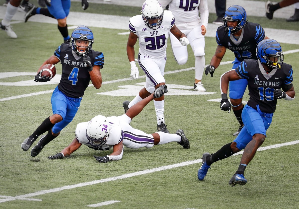 <strong>Memphis receiver Calvin Austin III (left) returns a punt past the Stephen F. Austin defense for a touchdown during action on Saturday, Nov. 21, 2020.</strong> (Mark Weber/The Daily Memphian)