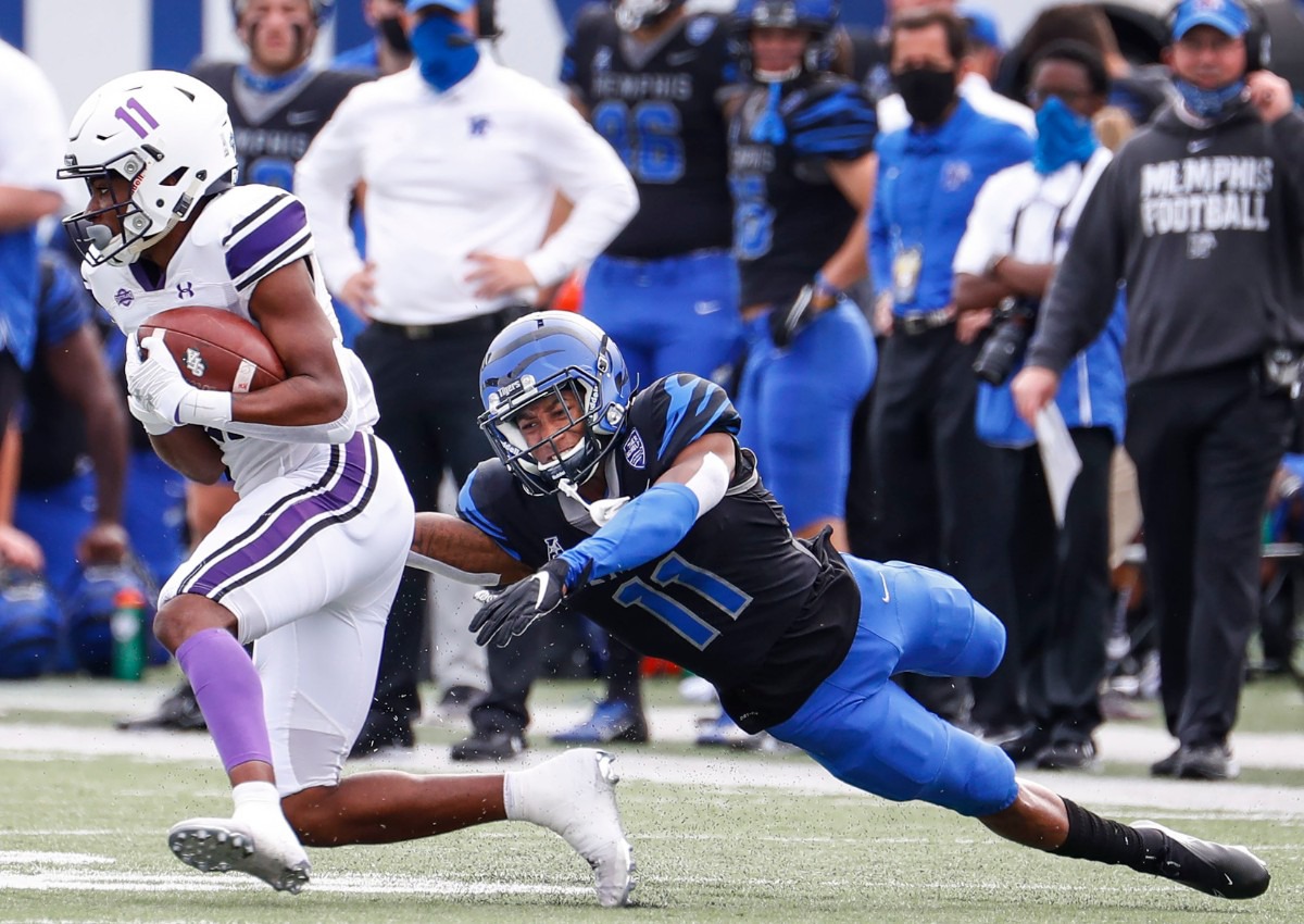 <strong>Memphis defender Sylvonta Oliver (right) is unable to bring down Stephen F. Austin receiver Jeremiah Miller (left) during action on Saturday, Nov. 21, 2020.</strong> (Mark Weber/The Daily Memphian)