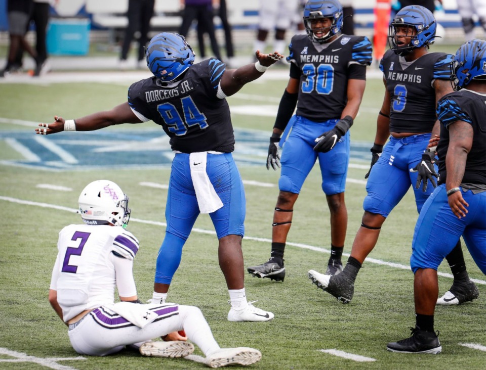 <strong>Memphis defender O'Bryan Goodson (middle) celebrates his sack against Stephen F. Austin during action on Saturday, Nov. 21, 2020.</strong> (Mark Weber/The Daily Memphian)