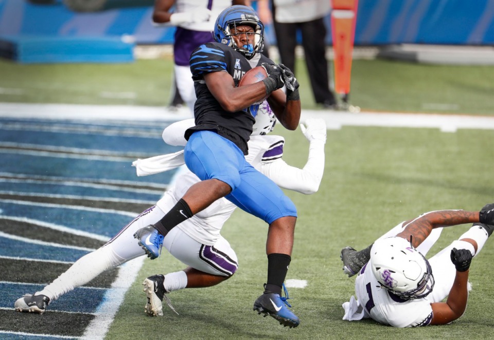 <strong>Memphis running back Asa Martin (middle) runs past the Stephen F. Austin defense for a touchdown during action on Saturday, Nov. 21, 2020.</strong> (Mark Weber/The Daily Memphian)