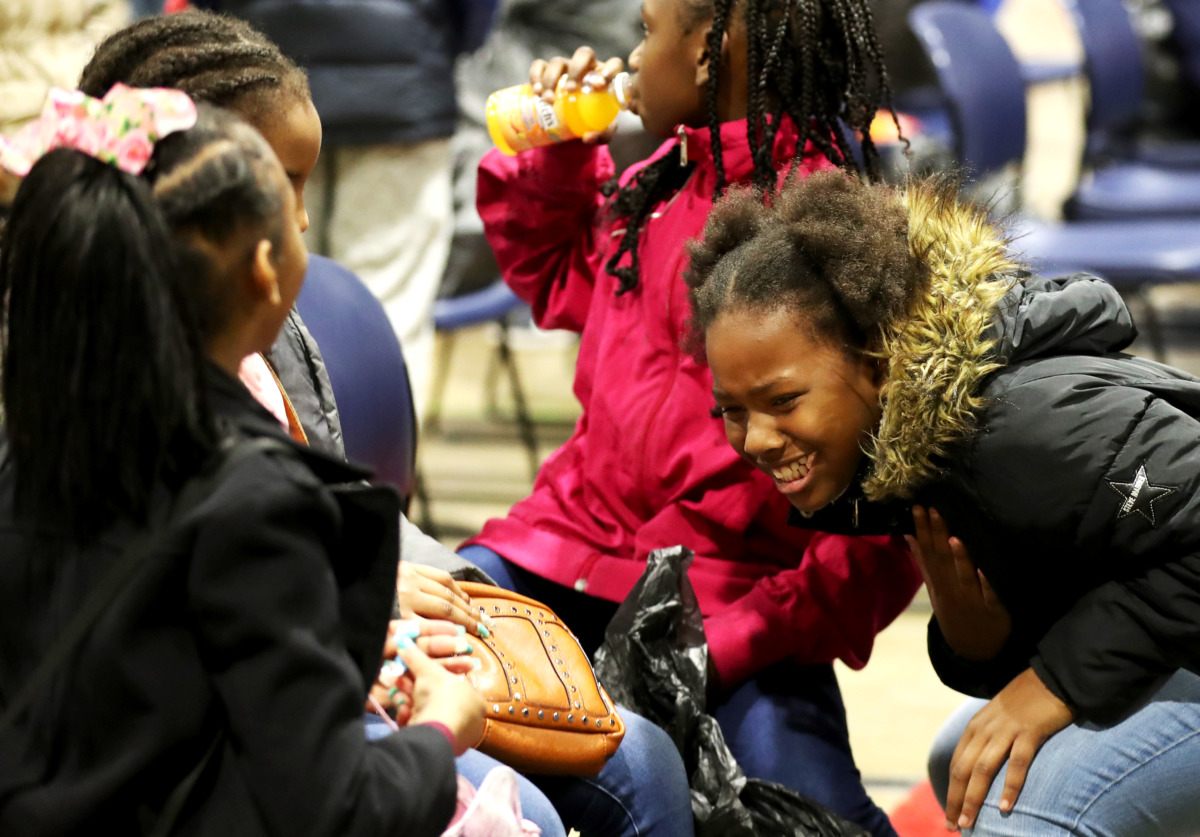 <strong>Saniya Richardson (right) and her friends attend a toy drive hosted by the University of Memphis and the City of Memphis.</strong> (Houston Cofield/Daily Memphian)