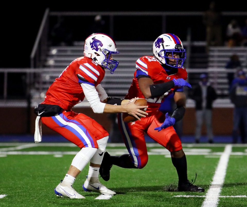 <strong>Bartlett High School quarterback Walt Tucker (5) hands the ball off to running back Robert Giaimo (21) during a during a Nov. 27 game against Brentwood High School.</strong> (Patrick Lantrip/Daily Memphian)