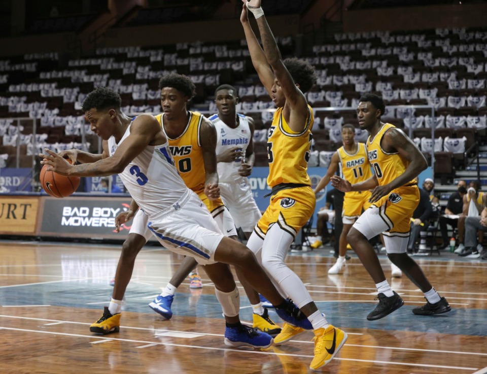 <strong>Landers Nolley II (3) of the Memphis Tigers falls away from Virginia Commonwealth defenders during the Bad Boy Mowers Crossover Classic at the Sanford Pentagon in Sioux Falls, S.D., Friday, Nov. 27.</strong> (Richard Carlson/Inertia)