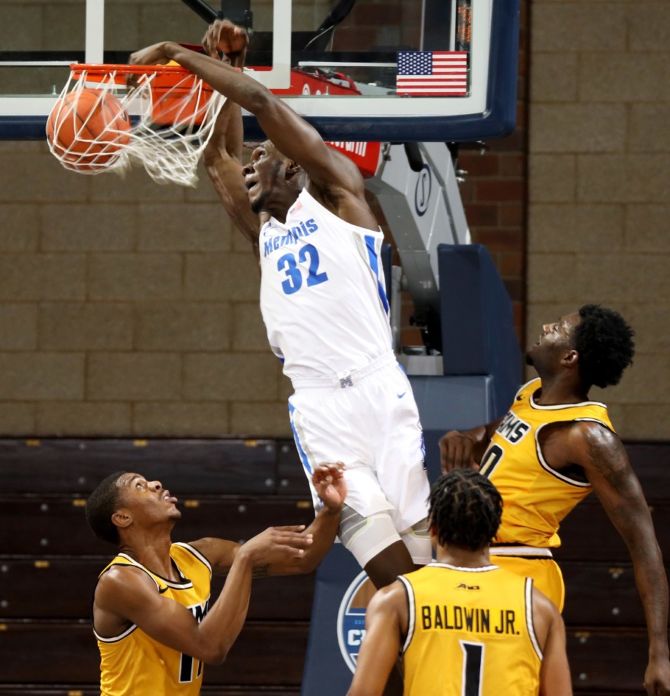<strong>Moussa Cisse (32) of the Memphis Tigers slams home two points against the Virginia Commonwealth Rams during the Bad Boy Mowers Crossover Classic Friday, Nov. 27 at the Sanford Pentagon in Sioux Falls, S.D.</strong> (Dave Eggen/Inertia)