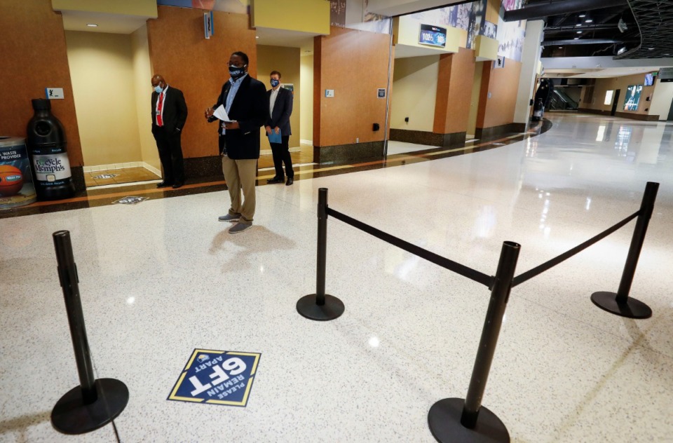 <strong>Officials lead a tour of FedExForum on Tuesday, Dec. 1, to show new coronavirus safety measures.</strong> (Mark Weber/Daily Memphian)